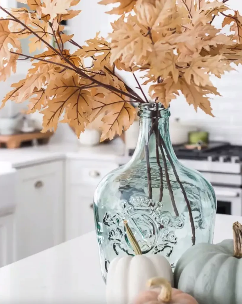 Large glass wine vase with faux Fall branches